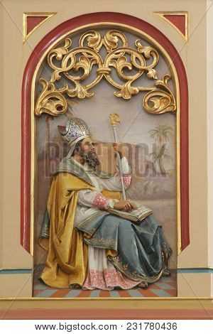 SISAK, CROATIA - DECEMBER 07: Saint Ambrose, Great Doctor of the Western Church, pulpit in the Church of Holy Cross in Sisak, Croatia, on December 07, 2017.