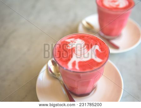Beetroot Latte On Marble Background With Unicorn Art On The Top. Flat Lay View. Color Trendy Latte.