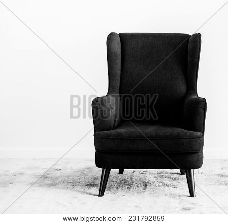 Wing back chair on a carpet no people