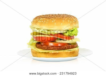 Tasty Hamburger, Beef Burger In Close-up On A Plate And Isolated On White Background.