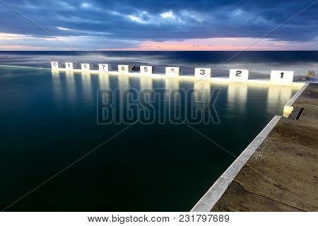 Morning Sunrise At Merewether Ocean Baths At Newcastle Australia. These Starting Blocks Are An Iconi