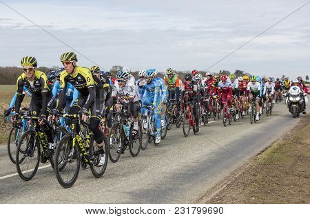 Fains-la-folie, France - March 5, 2018: The Peoton Riding On A Country Road During The Stage 2 Of Pa
