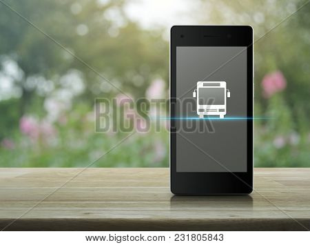 Bus Flat Icon On Modern Smart Phone Screen On Wooden Table Over Blur Pink Flower And Tree, Business 