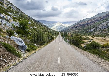 Stright Asphalt Road Of Europe Peaks In Spain On A Rainy Day