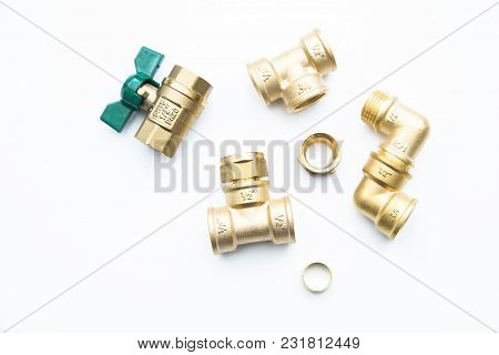 Various Plumbers Tools And Plumbing Materials Including Coper Pipe, Elbow Joint, Wrench And Spanner.