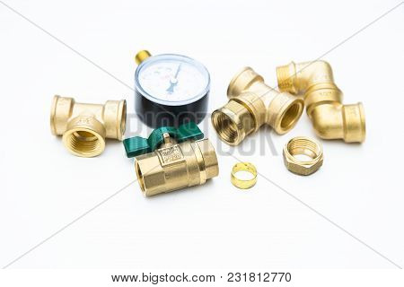 Various Plumbers Tools And Plumbing Materials Including Coper Pipe, Elbow Joint, Wrench And Spanner.