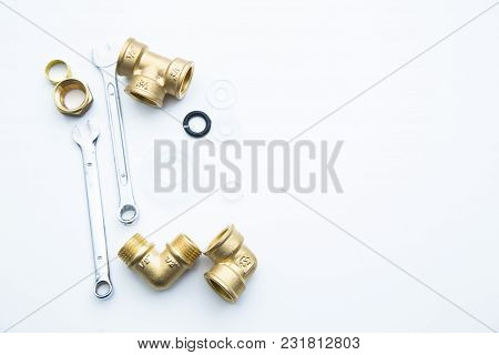 Various Plumbers Tools And Plumbing Materials Including Coper Pipe, Elbow Joint, Wrench And Spanner.