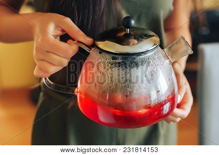 Raspberry Tea Raspberry Tea. A Girl Holding A Teapot With Raspberry Tea