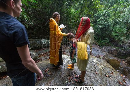 KOH CHANG, THAILAND - MAR 9, 2018: During Christian sacrament of spiritual birth - Baptism. There are currently 10 Orthodox parishes in Thailand, Orthodoxy is practiced by 0.002% of population.