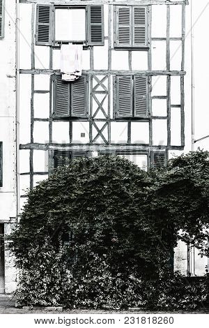 Classic European Architecture In France. French Fachwerk With Shutters In Biarritz. Poor House In A 