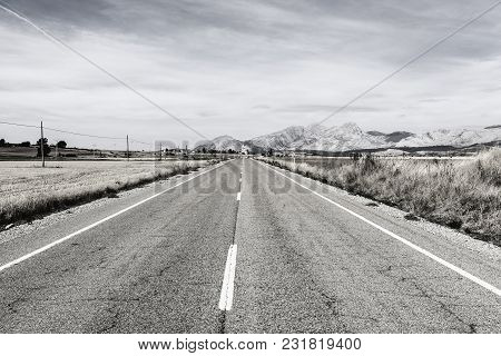 Stright Road Leading To The Inviting Church In Spain. Religious Concept
