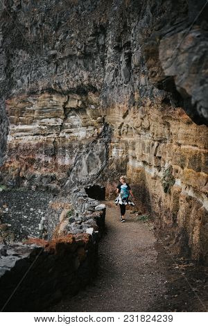 Tourist Women Walking Long Way Along Cliff And Rocky Dangerous Coastline From Cruzinha To Ponta Do S