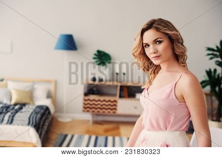 Young Happy Woman In Modern Spring Outfit - Floral Midi Skirt With Embroidery And Pink Top Relaxing 