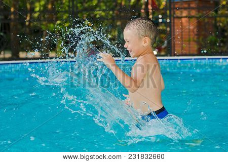 Child Is Playing In The Children's Pool