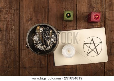 Overhead Photo Of Cauldron, Grimoire, And Candles