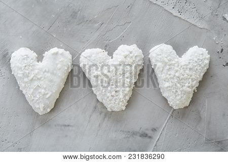 Sweet Crunchy Coconat Heart-shaped Biscuits Arranged In Pattern On Light Textured Background, Top Vi