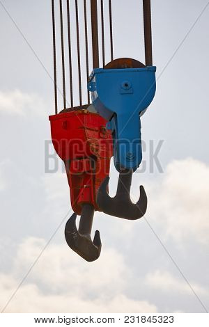 Heavy old steel hooks in a porr