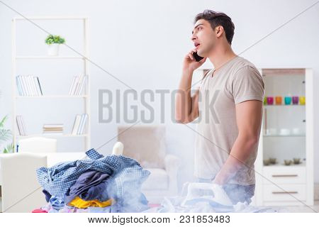 Inattentive husband burning clothing while ironing