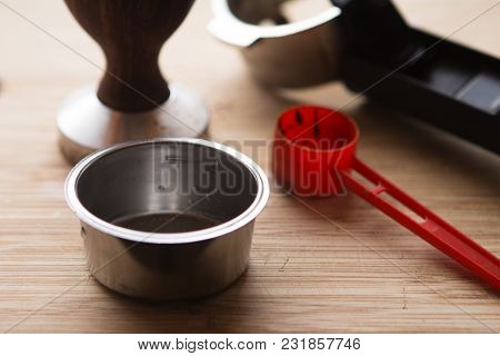 Coffee Tamper Without Coffee In Filter Basket And Filter Holder On A Wooden Board For Coffee Scrub