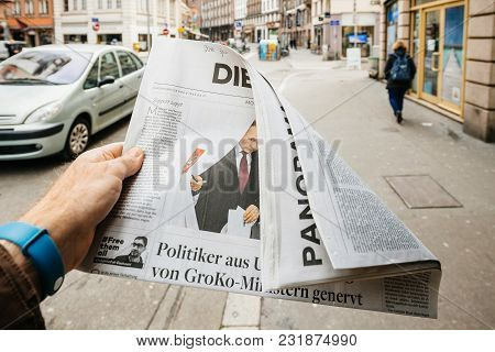 Paris, France - Mar 19, 2017: Man Reading Buying German Die Welt Newspaper At Press Kiosk Featuring 