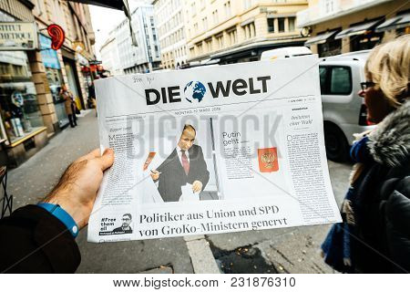 Paris, France - Mar 19, 2017: Man Reading Buying German Die Welt Newspaper At Press Kiosk Featuring 