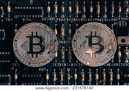 Printed Circuit Board With A Chip And Resistance And A Bitcoin. The Concept Of The Mining Of Crypto-