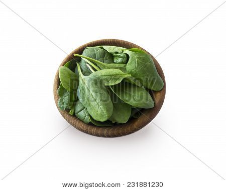 Spinach In Wooden Bowl. Top View. Spinach Isolated On A White Background. Green Spinach With Copy Sp