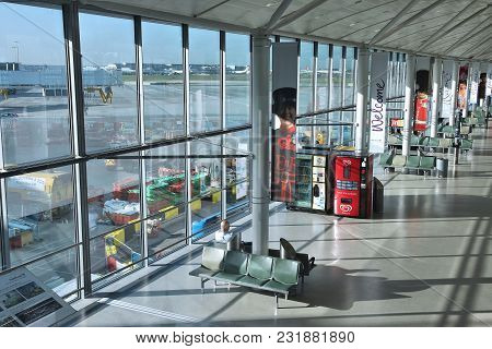 London, Uk - April 16, 2014: Lonesome Passenger Sits At London Heathrow Airport, Uk. Heathrow Is The