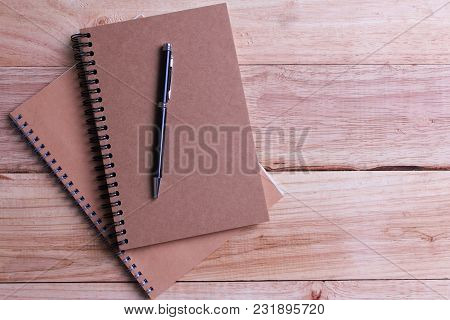 Top View Book With Blank Pages And Pen On Wooden Background