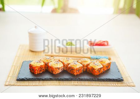 Homemade Sushi With Salmon, Omelet, Cucumber And Soft Cheese. Rustic Style.
