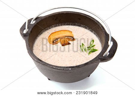 Mushroom Soup In Brutal Rustic Black Metal Pot On White.