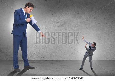 Bad angry boss shouting at employee with loudspeaker