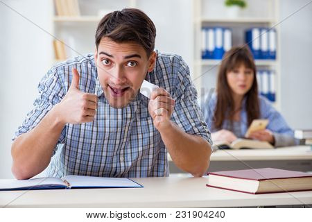 Students sitting and studying in classroom college