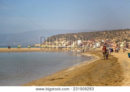 Agadir, Morocco - September 6, 2014: Unindentified People At Beach In Agadir, Morocco. Beaches On At
