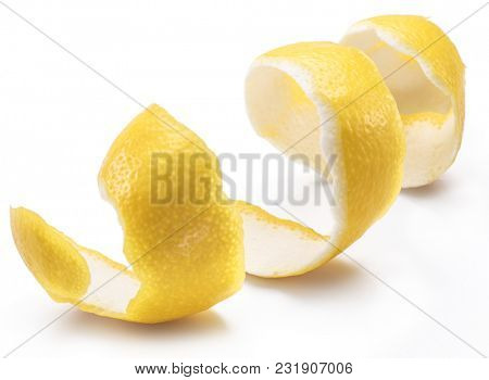 Lemon peel or lemon twist on white background. Close-up.