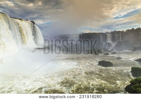 Tourists At Iguassu Falls At Iguassu National Park, World Natural Heritage Site By Unesco