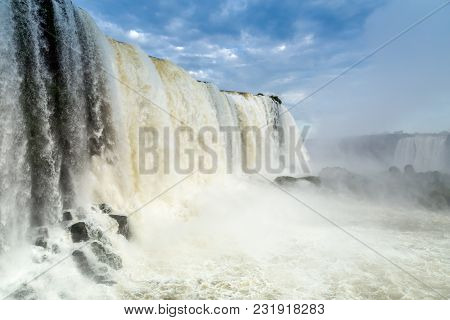 Tourists At Iguassu Falls At Iguassu National Park, World Natural Heritage Site By Unesco