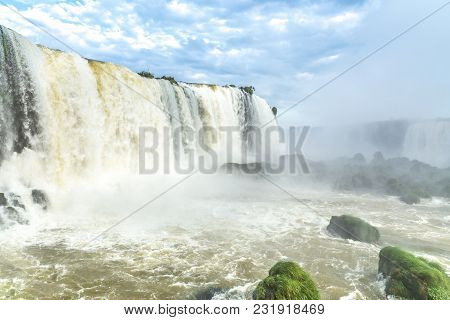 Tourists At Iguassu Falls At Iguassu National Park, World Natural Heritage Site By Unesco