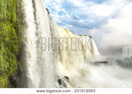 Tourists At Iguassu Falls At Iguassu National Park, World Natural Heritage Site By Unesco
