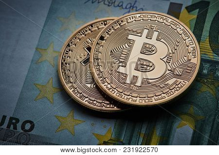 Gold coin Bitcoins, and Euro banknote Cryptocurrency