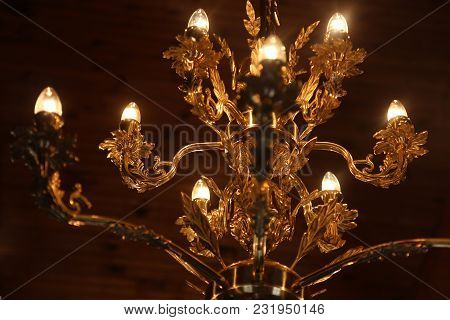 Luxury Gold Chandelier On Ceiling. Lighting. Interior Design