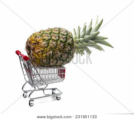 Shopping Cart With Pineapple Isolated On White Background, Shopping In Supermarke, Buying Food At Th