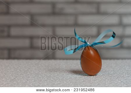 Delicious Seasonal Chocolate Easter Egg With A Ribbon