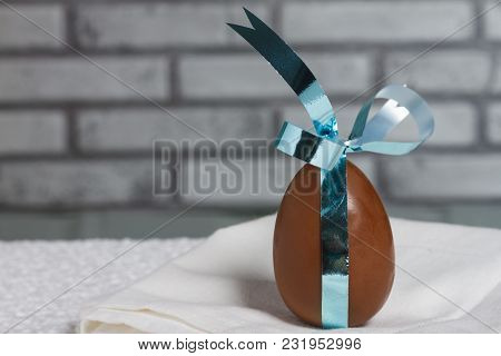 Delicious Seasonal Chocolate Easter Egg With A Ribbon