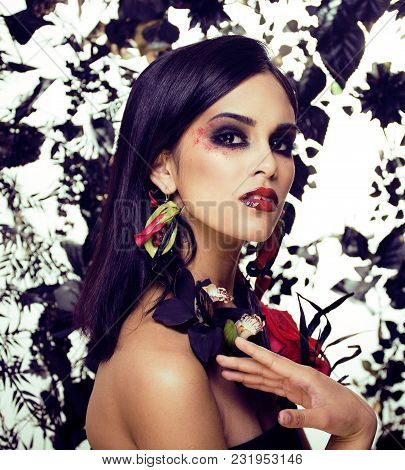 Pretty Brunette Woman With Rose Jewelry, Black And Red, Bright Make Up Kike A Vampire Closeup Red Li