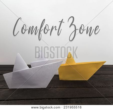 Comfort Zone Concept. Paper Boats On Wood With Inscription: Comfort Zone. Horizontal View.