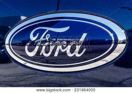 Fishers - Circa March 2018: Ford Oval tailgate logo on an F150 pickup truck. Ford sells products under the Lincoln and Motorcraft brands IX