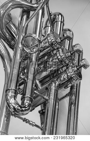 Black And White Image Of Valves On A Sousaphone.