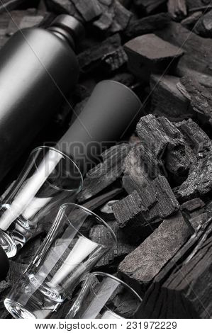 Black Set Of Matte Bottle Of Alcohol And Shot Glasses. On Charcoal Background. Black Edition.creativ