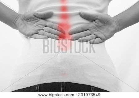 Attractive Female Person Suffers From Backache. All On White Background.pain In The Lower Back,